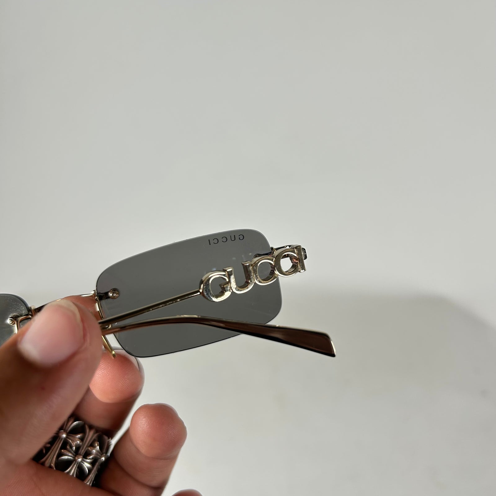 Gucci Spellout Logo Rimless Sunglasses