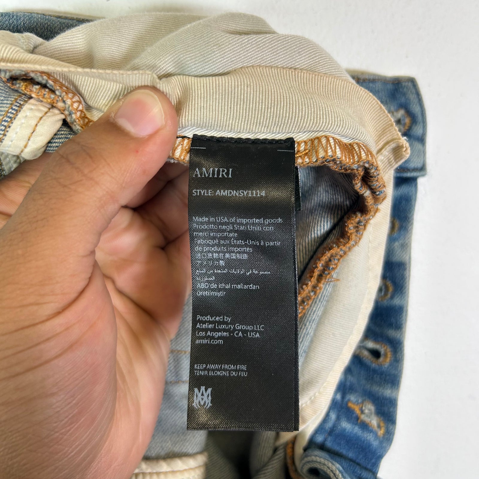 Amiri Lightwash Staggered Logo Denim Jeans