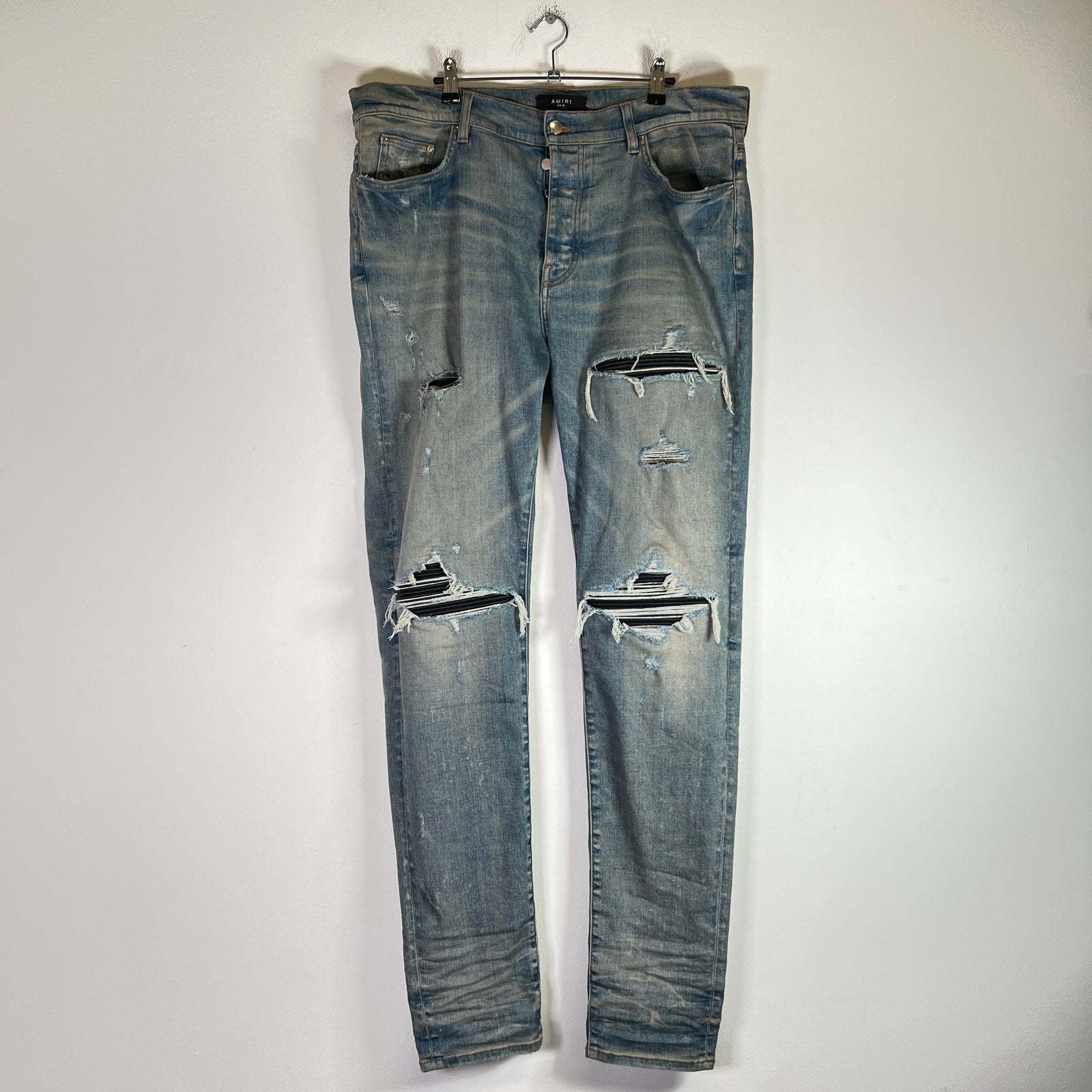 Amiri Light Indigo MX1 Black Patch Denim Jeans