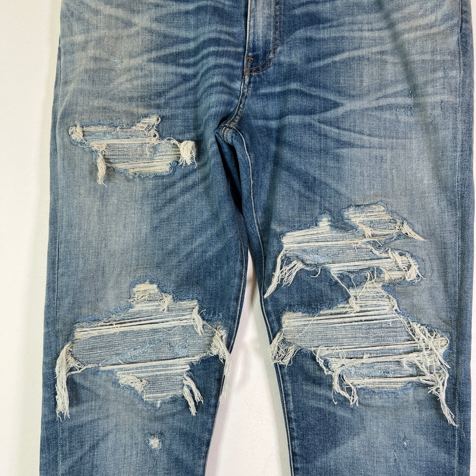 Amiri Lightwash Denim Patch Distressed Jeans