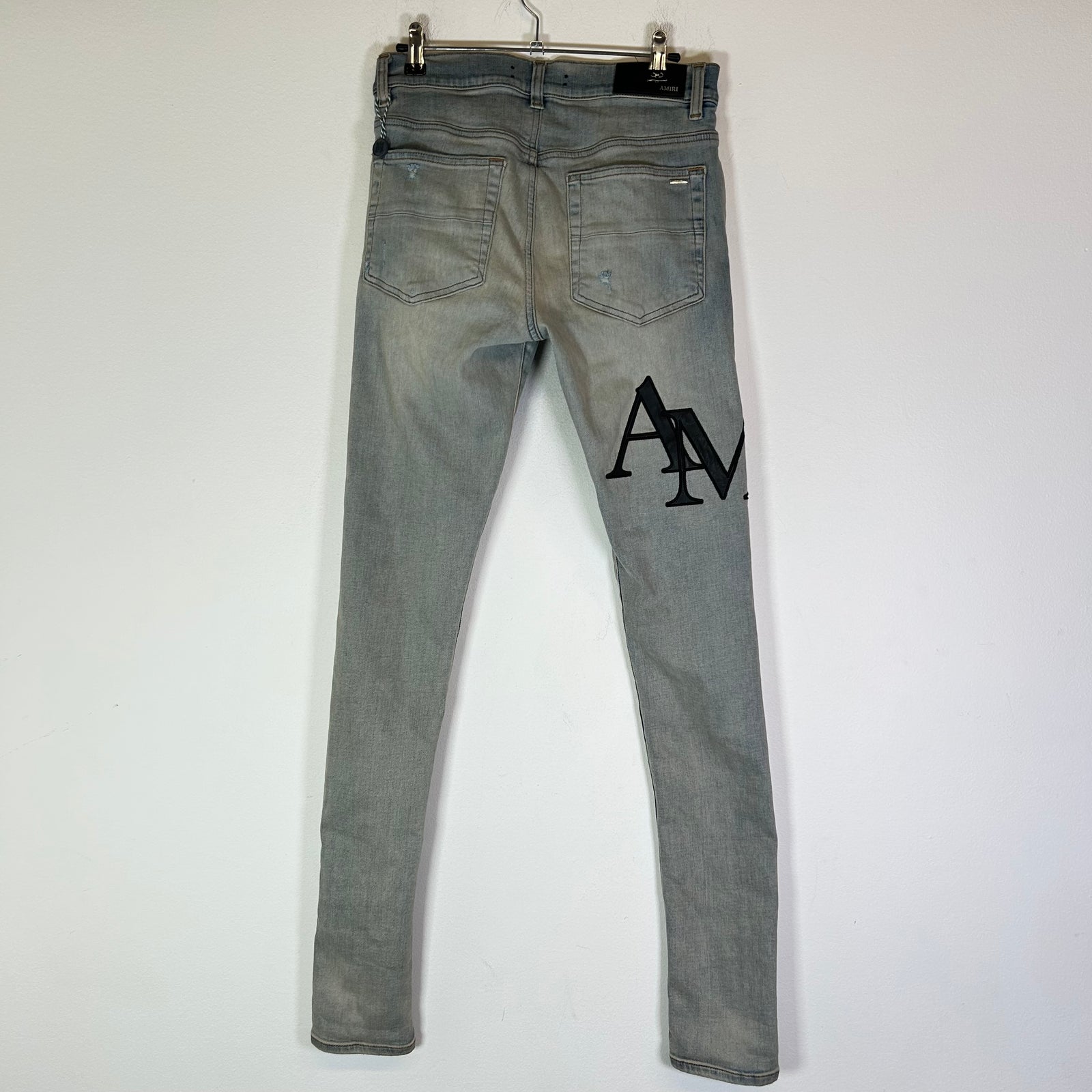 Amiri Lightwash Staggered Logo Denim Jeans