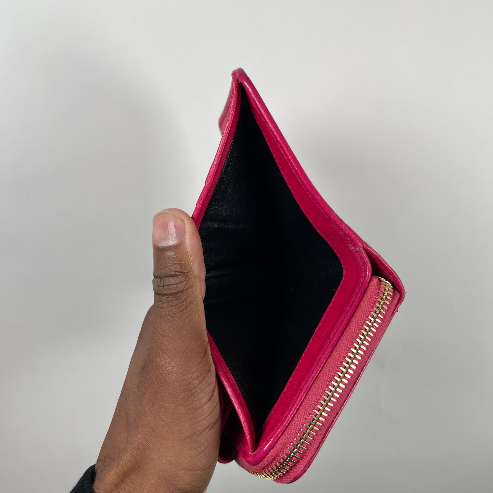 Yves Saint Laurent Pink Cassandra Embossed Round Zip Wallet