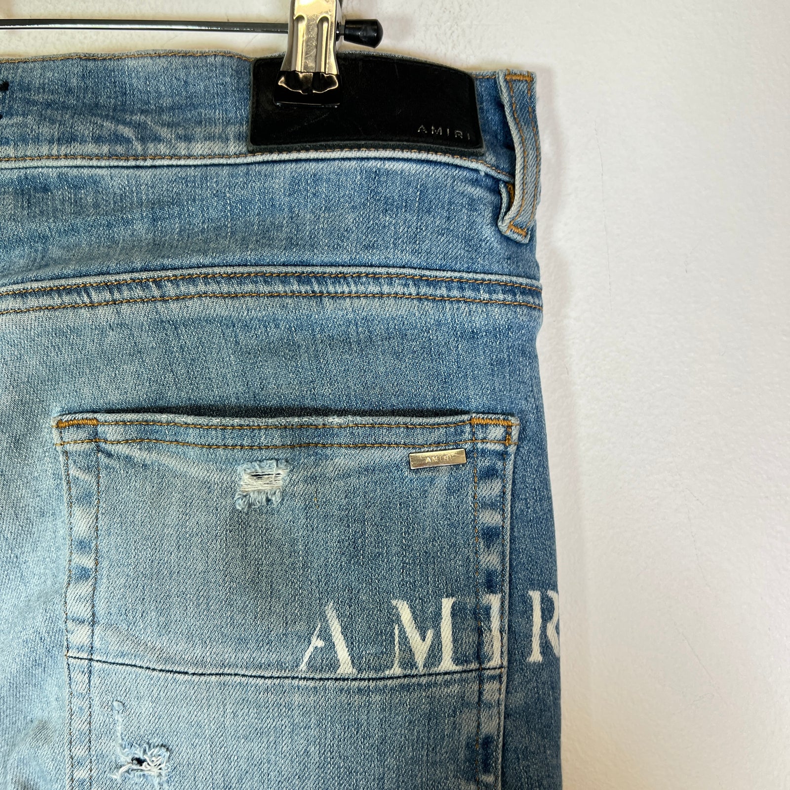 Amiri Lightwash Hibiscus Stencil Jeans