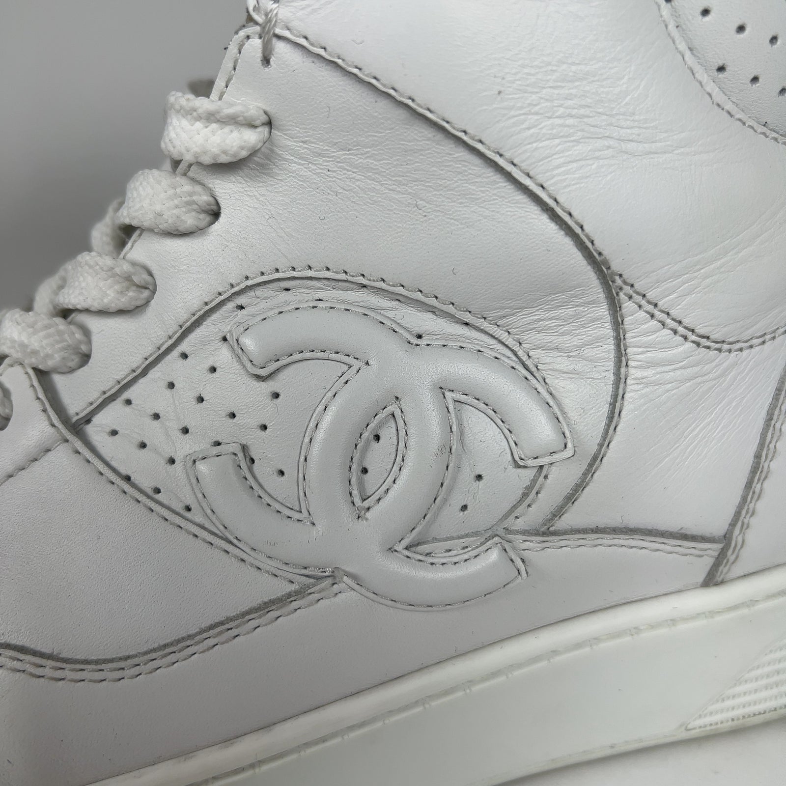 Chanel CC Triple White Hightop Sneakers