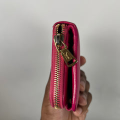 Yves Saint Laurent Pink Cassandra Embossed Round Zip Wallet