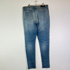 Amiri Lightwash Denim Patch Distressed Jeans