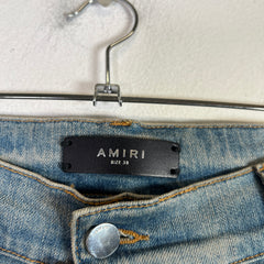 Amiri Light Indigo MX1 Black Patch Denim Jeans