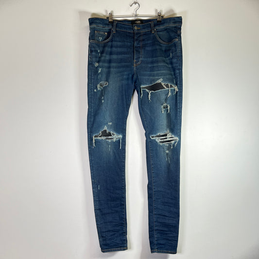 Amiri MX1 Dark Blue Wash Black Patch Denim Jeans