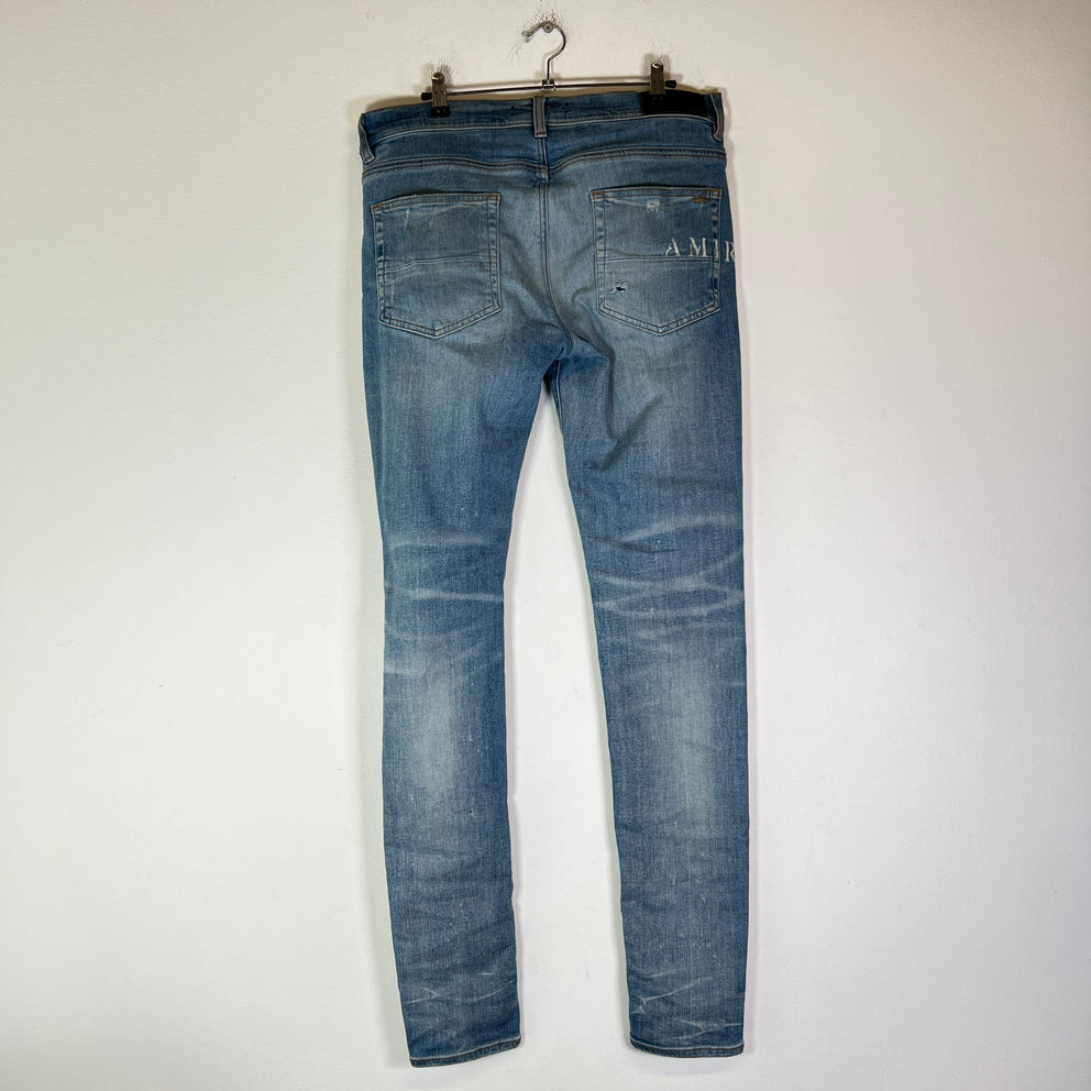 Amiri Lightwash Hibiscus Stencil Jeans