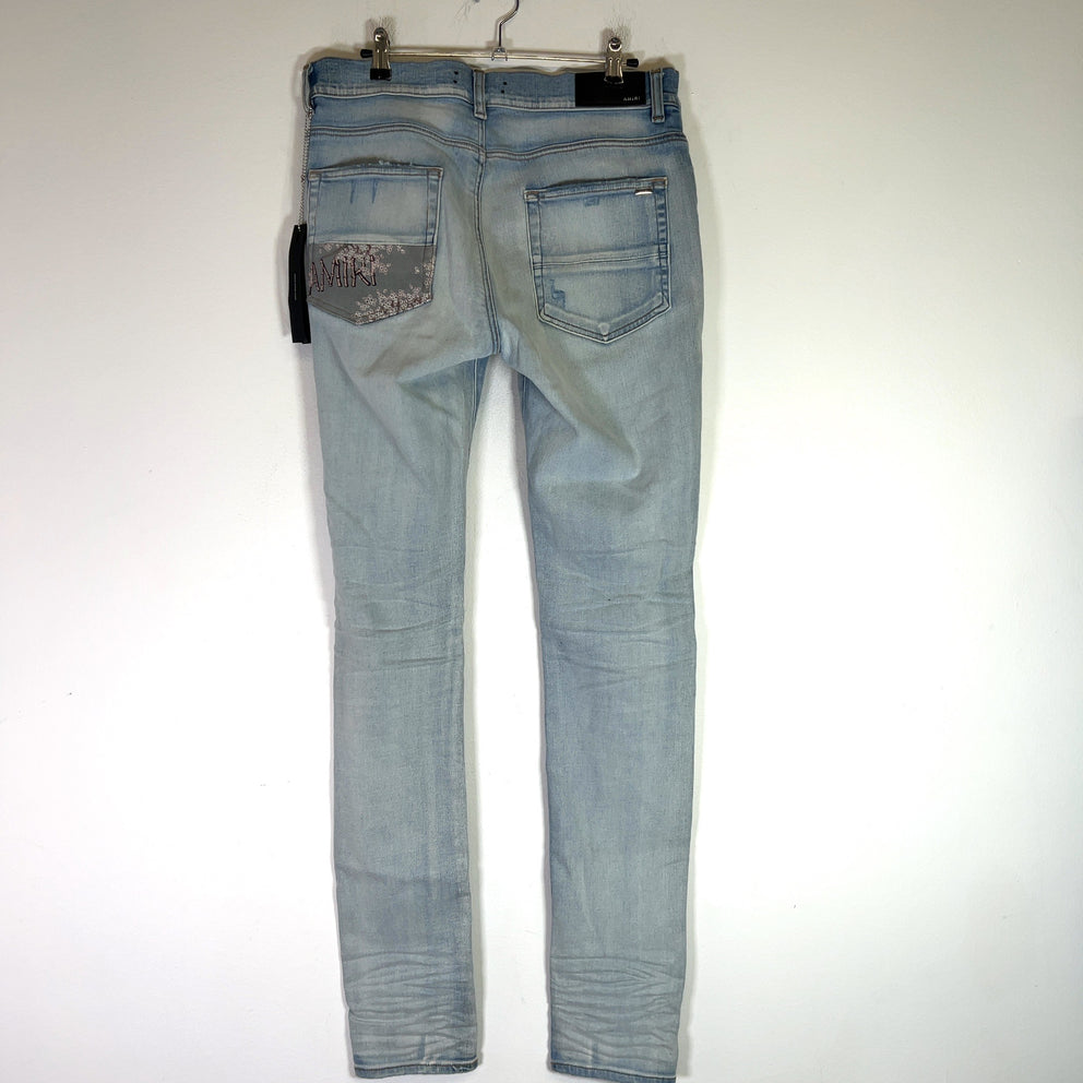 Amiri Light Indigo Hibiscus Art Patch Denim Jeans