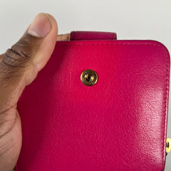 Yves Saint Laurent Pink Cassandra Embossed Round Zip Wallet