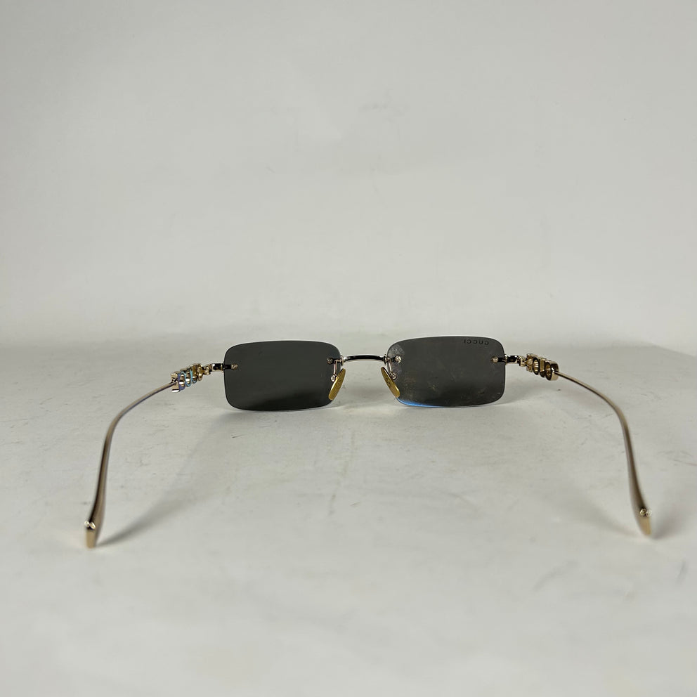 Gucci Spellout Logo Rimless Sunglasses