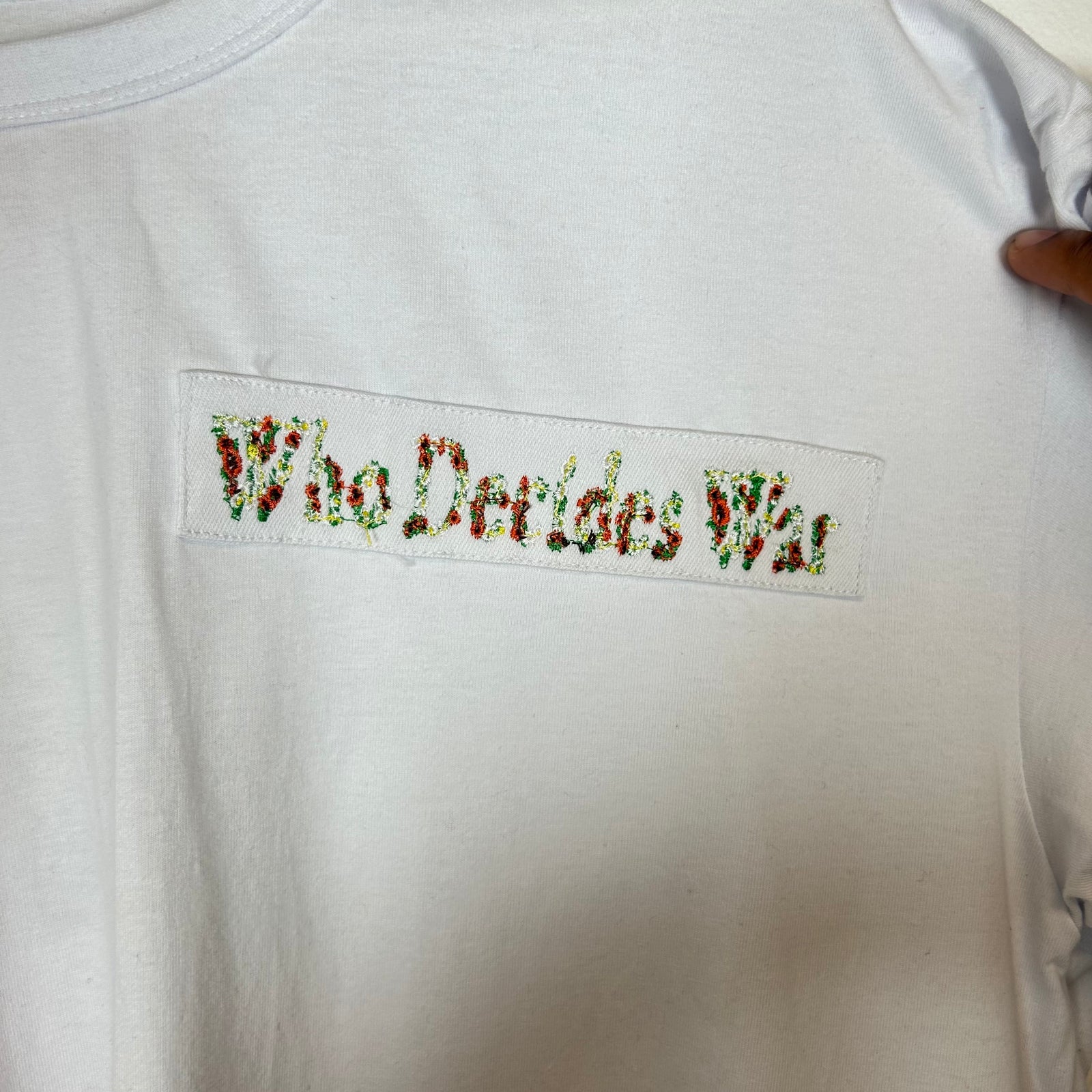 Who Decides War White Nameplate Embroidered Tee Size L