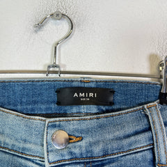 Amiri Lightwash Denim Patch Distressed Jeans