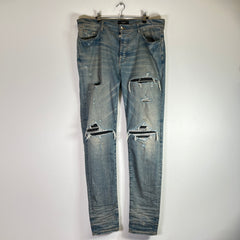 Amiri Light Indigo MX1 Black Patch Denim Jeans