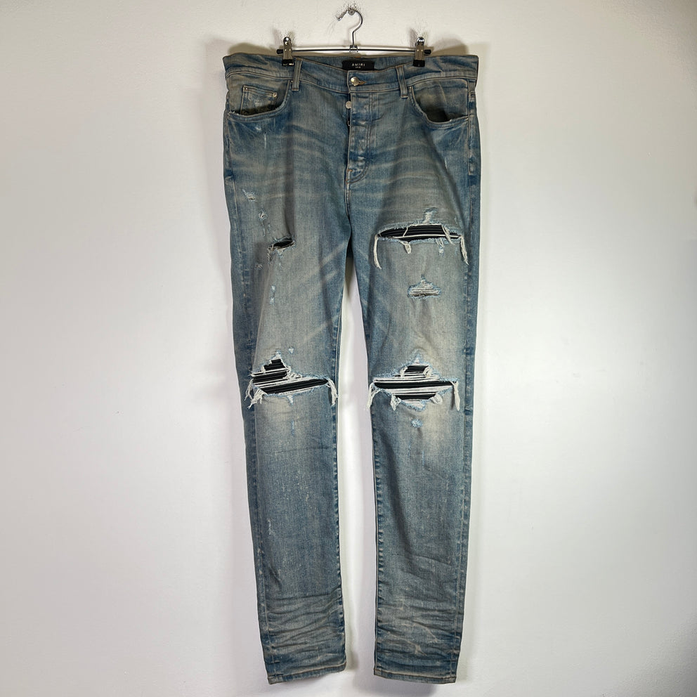 Amiri Light Indigo MX1 Black Patch Denim Jeans