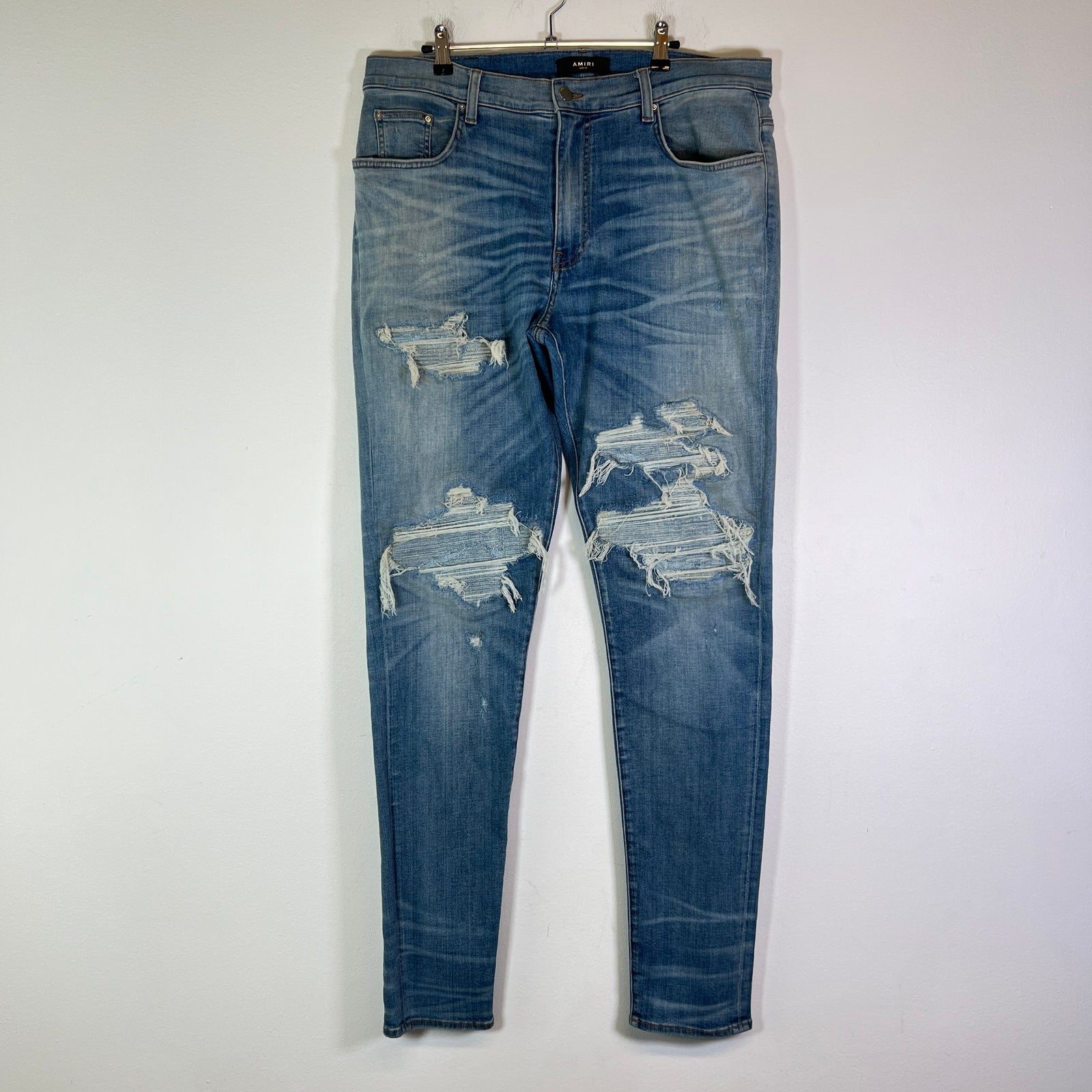 Amiri Lightwash Denim Patch Distressed Jeans