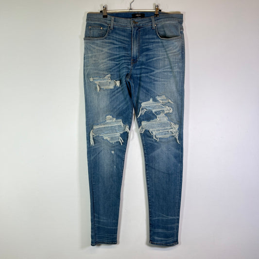 Amiri Lightwash Denim Patch Distressed Jeans