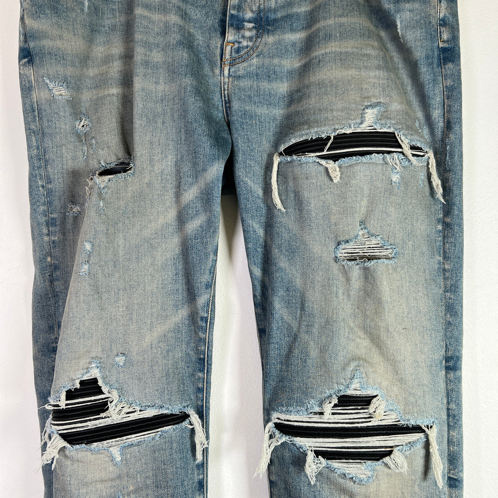Amiri Light Indigo MX1 Black Patch Denim Jeans