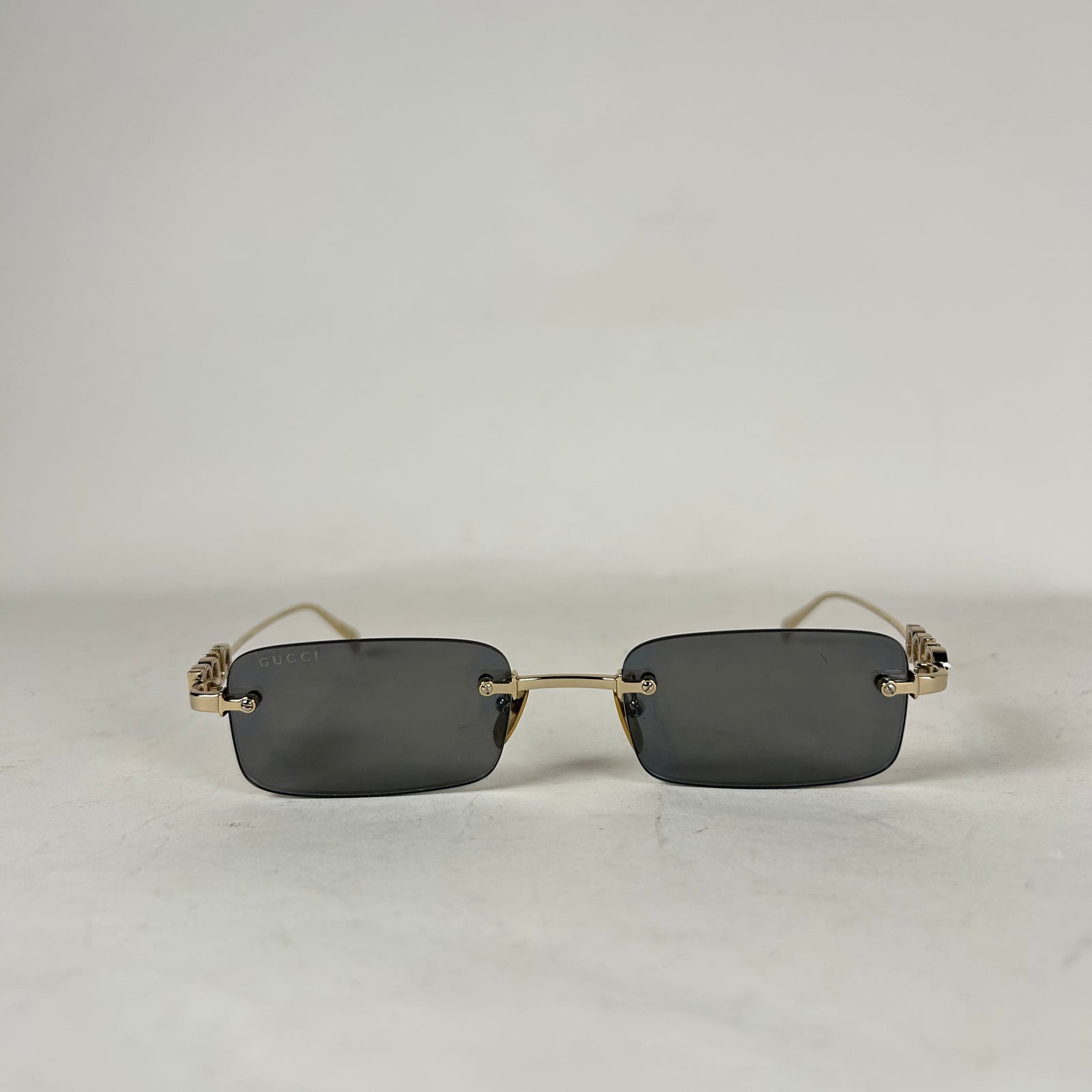 Gucci Spellout Logo Rimless Sunglasses