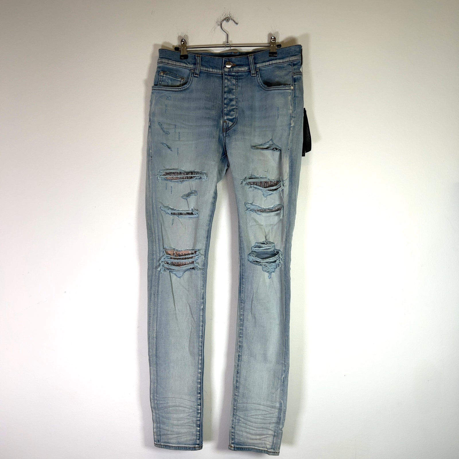 Amiri Light Indigo Hibiscus Art Patch Denim Jeans