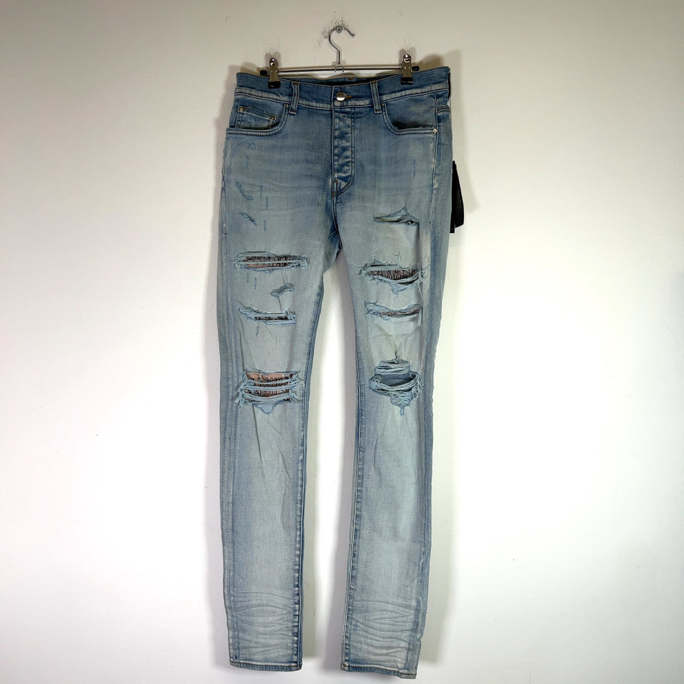 Amiri Light Indigo Hibiscus Art Patch Denim Jeans
