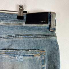 Amiri Light Indigo MX1 Black Patch Denim Jeans