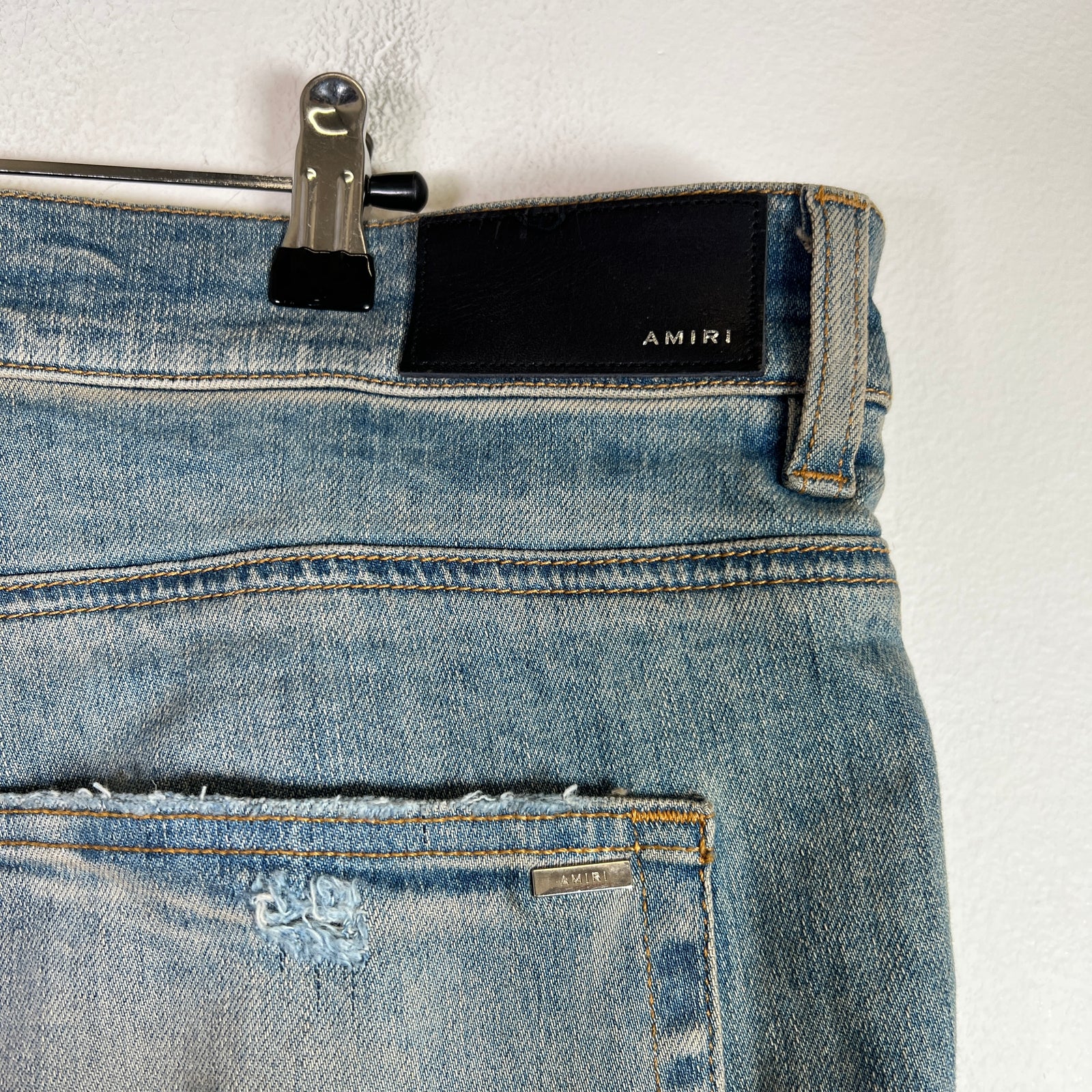 Amiri Light Indigo MX1 Black Patch Denim Jeans