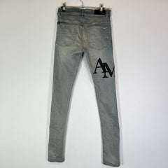 Amiri Lightwash Staggered Logo Denim Jeans