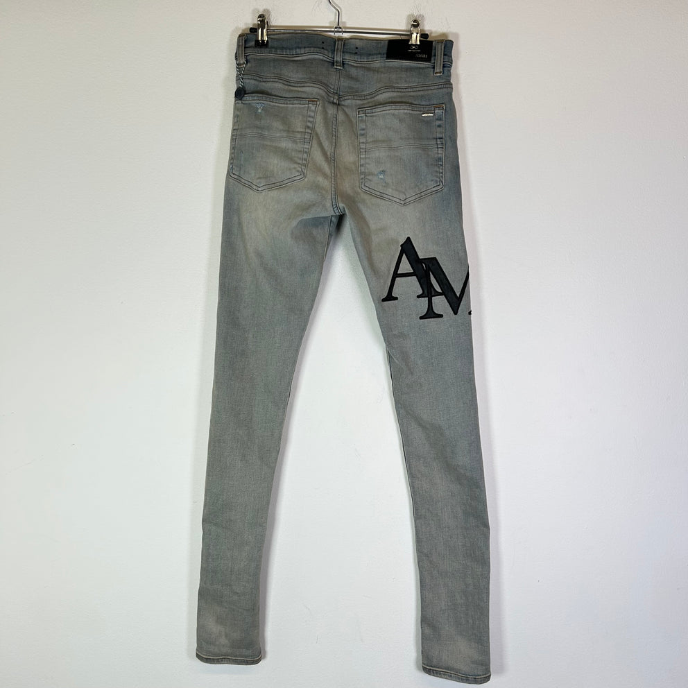 Amiri Lightwash Staggered Logo Denim Jeans