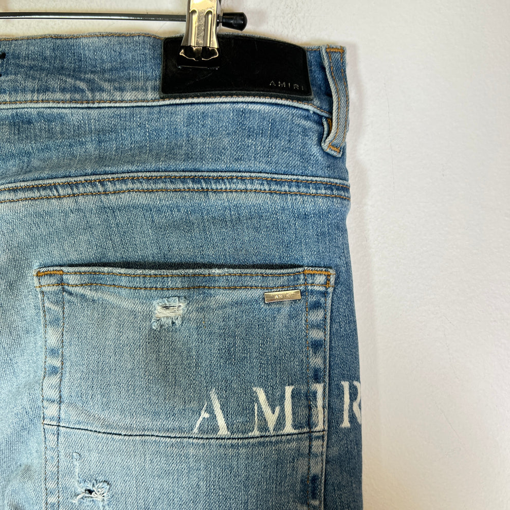 Amiri Lightwash Hibiscus Stencil Jeans