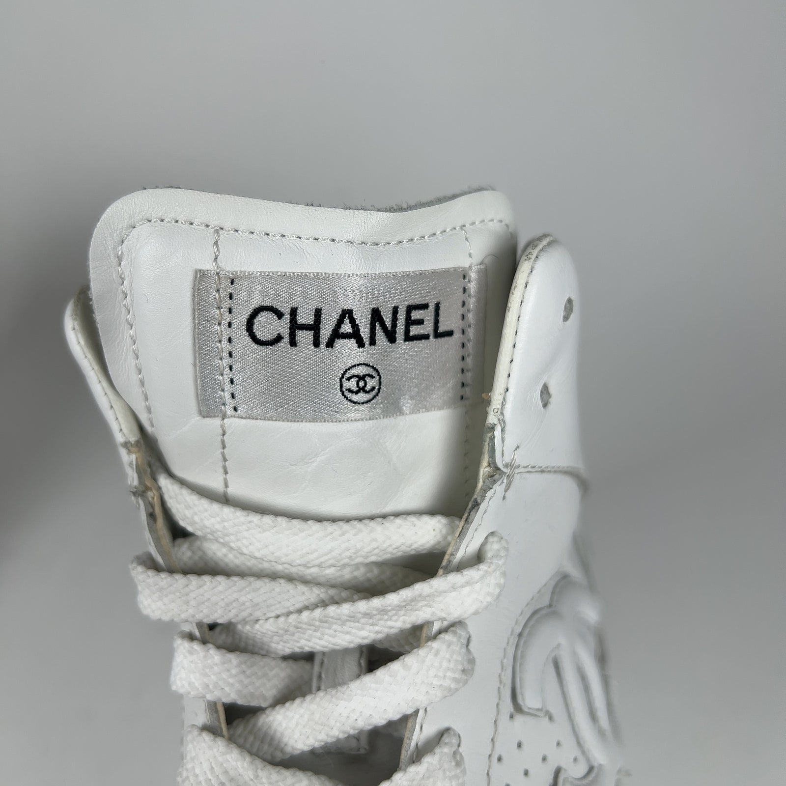 Chanel CC Triple White Hightop Sneakers