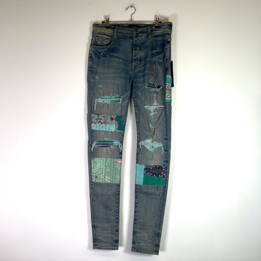 Amiri Clay Indigo Quilted Art Patch Denim Jeans