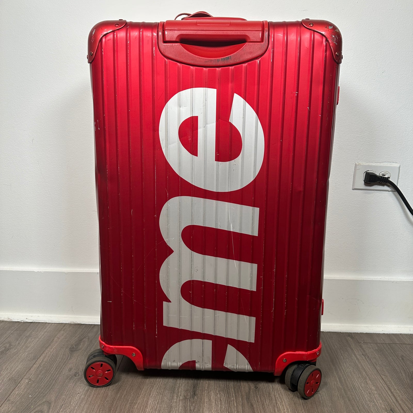 Supreme Rimowa Red Topas 82L Suitcase